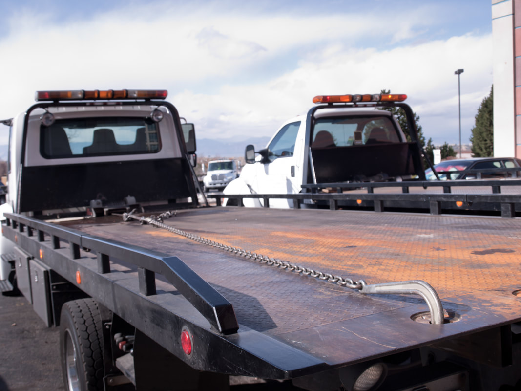 Fleet of flatbed Tow Trucks in Brockton, MA